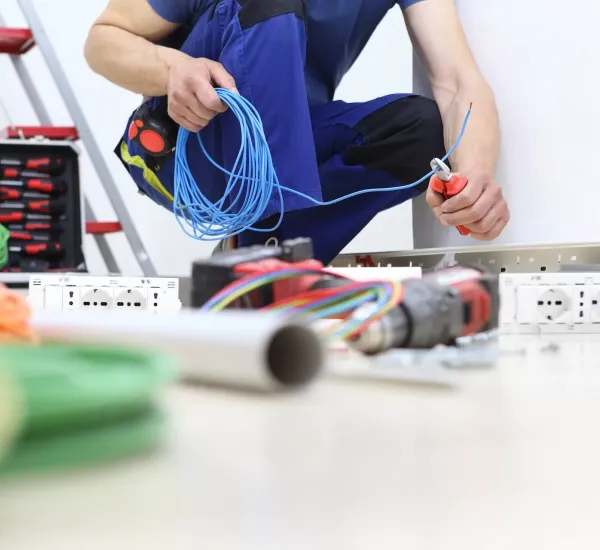 electrician at work surrounded by tools